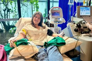Abbey smiling while donating stem cells at hospital