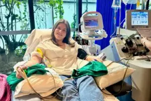 Abbey smiling while donating stem cells in hospital