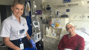 Trace Richey in hospital during his stem cell transplant with his nurse