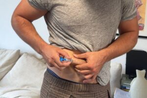 Stem cell donor self-injecting G-CSF into the belly before donation day