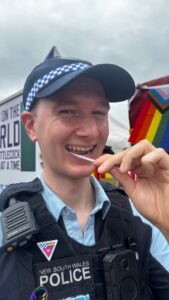 Young NSW police officer joining the stem cell registry with a cheek swab in Australia
