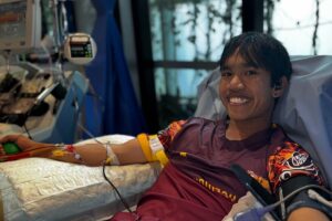 A young man donating his stem cells through PBSC